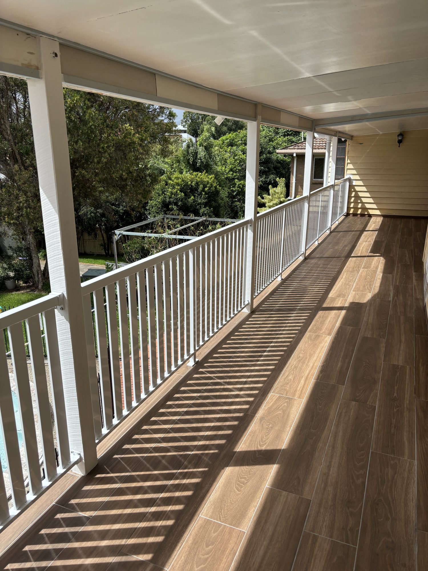 White aluminium balustrading along an elevated Brisbane veranda